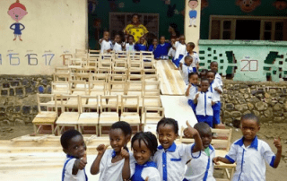 Coffee Wholesaler delivers chairs and tables to support local school